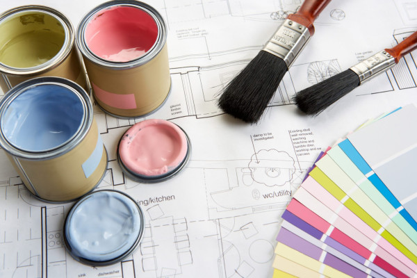 Decorating tools and materials on top of blue prints